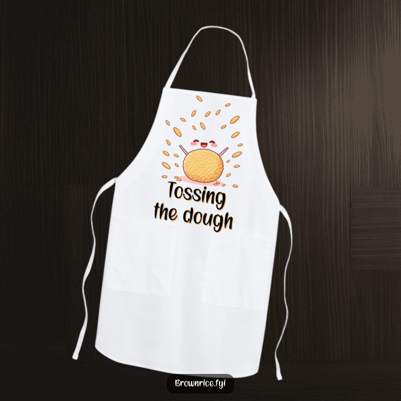 Funny happy brown rice ball tossing brown rice grains in the air, a durable kitchen apron with a delightful cartoon illustration.