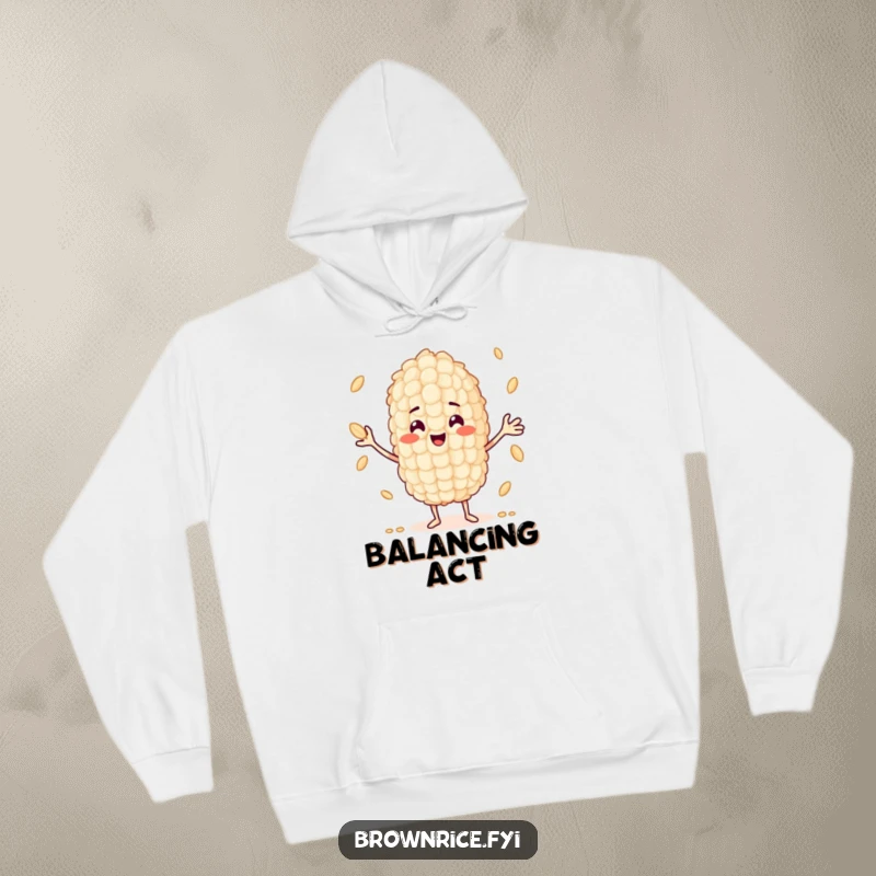 Funny smiling rice grain character in the action of juggling multiple small rice grains, featured on a cozy hoodie.