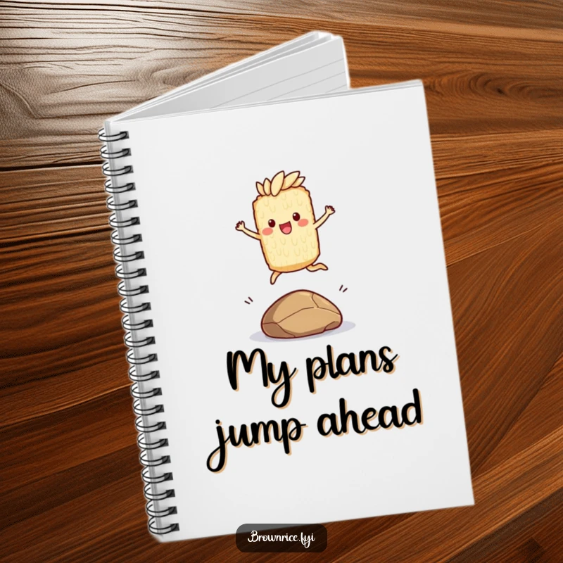 Funny notebook with a brown rice character joyfully leaping over a small pebble, perfect for jotting down inspired ideas.