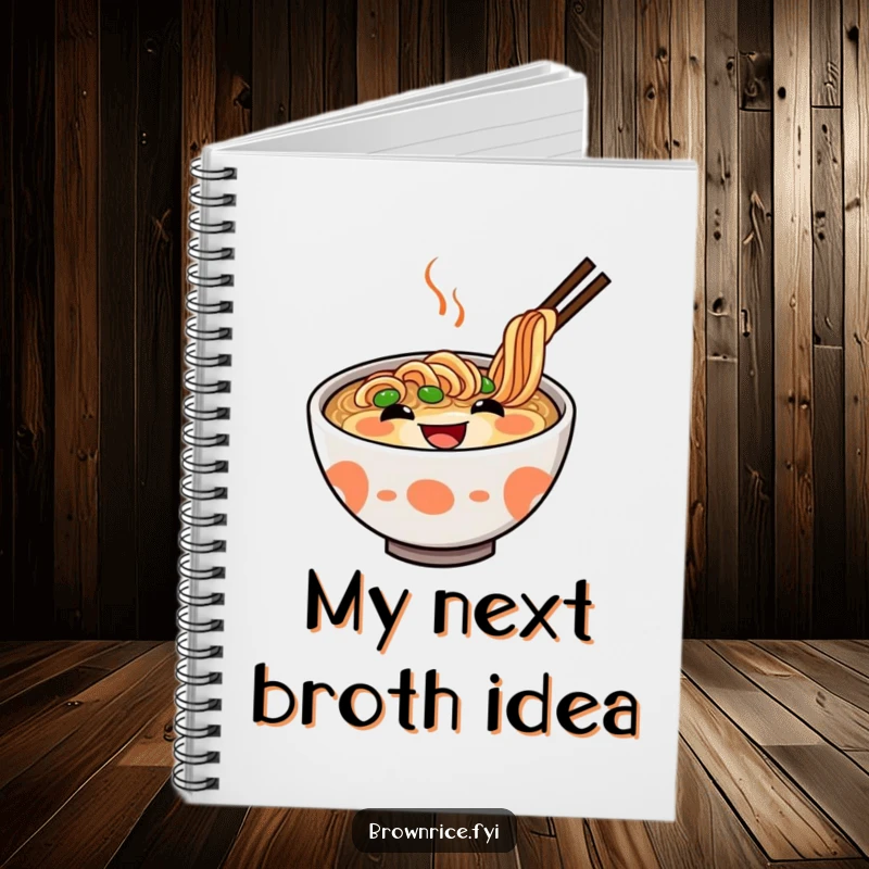 Funny Ramen Notebook with a delighted ramen bowl and a big grin on the cover, perfect for notes and doodles. A funnier gift.